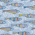 Seamless pattern with cute doodle sardines in the water